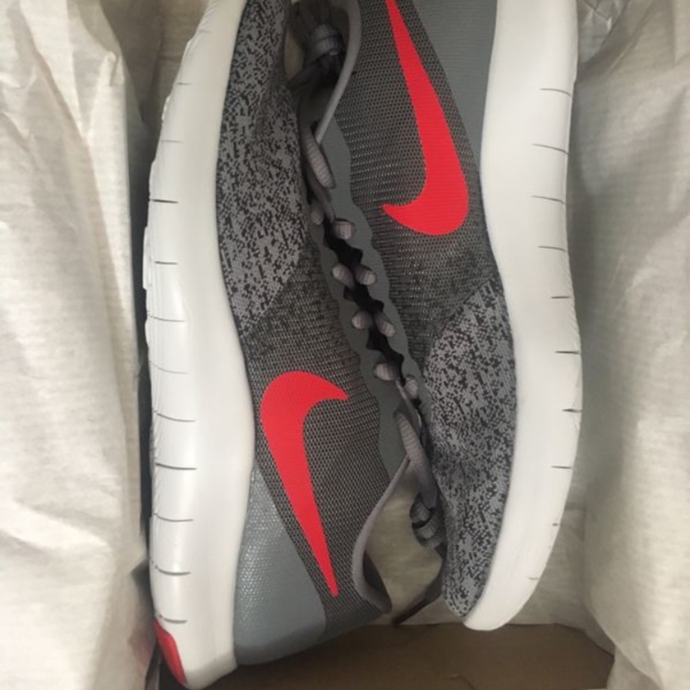 Brand new gray and red Nike Flex woman's shoes.